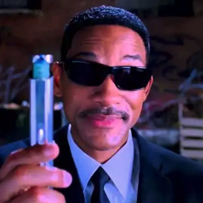 A Photo of Will Smith in Men in Black, holding up a neuralyzer.